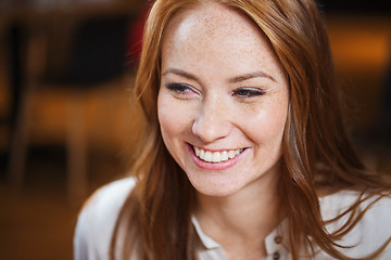 Image showing smiling happy young redhead woman face