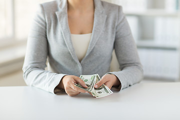 Image showing close up of woman hands counting us dollar money