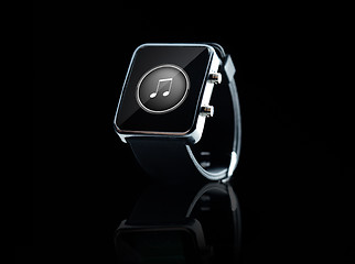 Image showing close up of black smart watch with music note icon