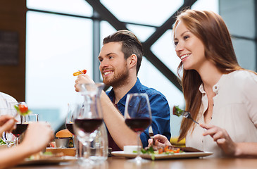 Image showing happy couple having dinner at restaurant