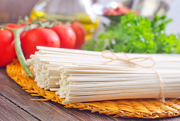 Image showing raw pasta and  tomato and sauce