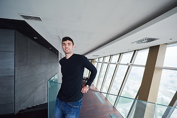 Image showing young successful man in penthouse apartment