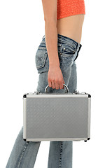 Image showing Young woman with metal suitcase