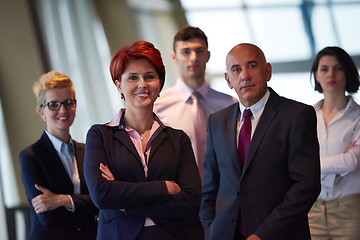 Image showing diverse business people group with redhair  woman in front