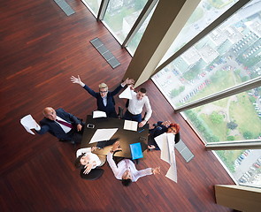 Image showing top view of business people group throwing dociments in air