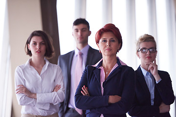 Image showing diverse business people group with redhair  woman in front