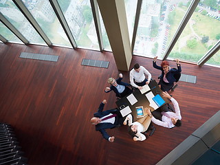 Image showing top view of business people group throwing dociments in air