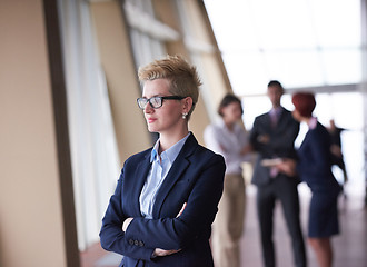 Image showing business people group, woman in front  as team leader