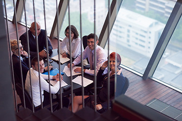 Image showing business people group on meeting at modern bright office