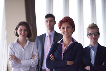 Image showing diverse business people group with redhair  woman in front