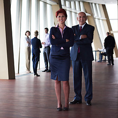 Image showing diverse business people group with redhair  woman in front