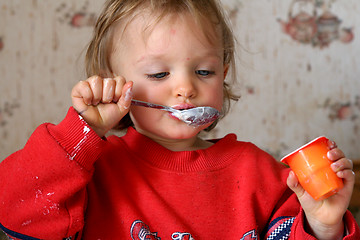 Image showing Eating yogurt