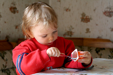 Image showing Eating yogurt