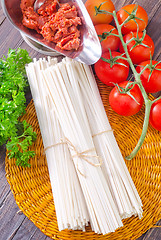Image showing raw pasta and  tomato and sauce