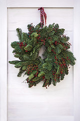 Image showing Christmas wreath hanging on door