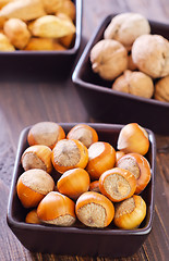 Image showing nuts in the black bowls