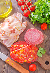Image showing sausages,ham and salami on board