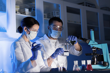 Image showing close up of scientists making test in lab