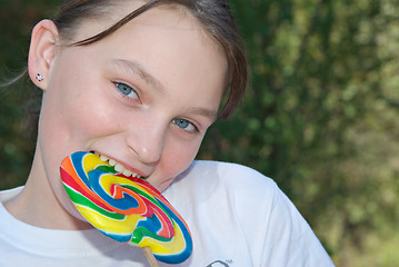 Image showing teenager with lollipop