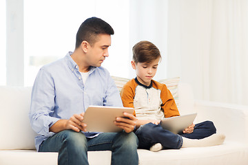 Image showing father and son with tablet pc at home