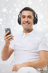 Image showing happy man with smartphone and headphones