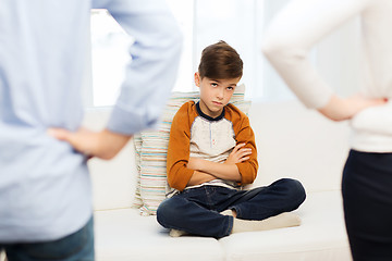 Image showing upset or feeling guilty boy and parents at home