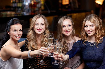Image showing happy women with champagne glasses at night club
