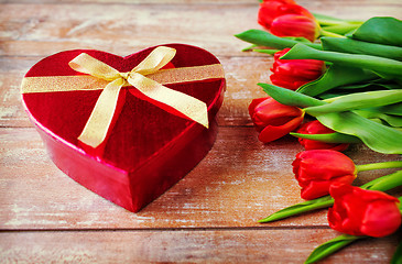 Image showing close up of red tulips and chocolate box