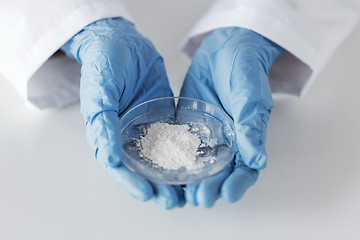 Image showing close up of scientist holding petri dish in lab