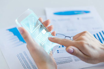 Image showing close up of woman with transparent smartphone