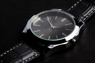 Image showing close up of black classic male wristwatch