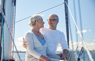 Image showing senior couple hugging on sail boat or yacht in sea