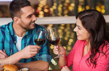 Image showing happy couple dining and drink wine at restaurant