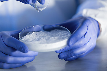 Image showing close up of scientists hands with chemicals in lab