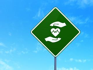 Image showing Insurance concept: Heart And Palm on road sign background