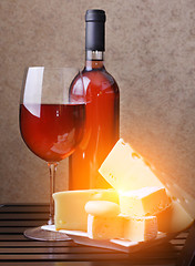 Image showing wineglass, bottle of wine cheese