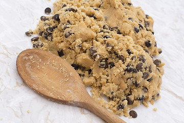 Image showing Wooden spoon with chocolate chip cookie dough