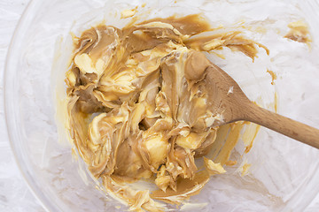 Image showing Combining butter and smooth peanut butter