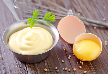 Image showing mayonnaise in metal spoon on wooden board