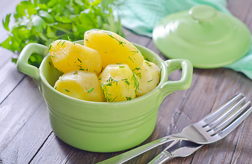 Image showing boiled potato in green bowl
