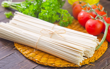 Image showing raw pasta and  tomato and sauce