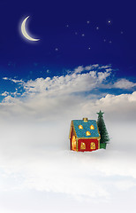 Image showing Christmas festive light in house under blue sky