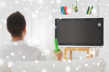 Image showing man watching tv and drinking beer at home