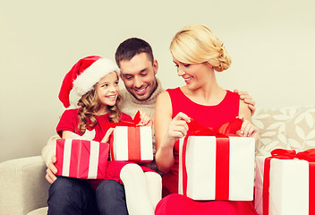 Image showing happy family opening gift boxes