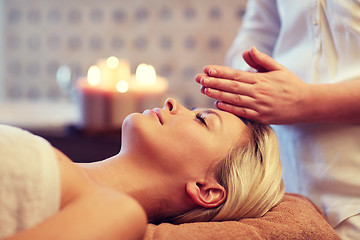 Image showing close up of woman having face massage in spa