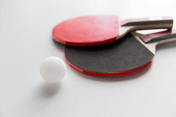 Image showing close up of table tennis rackets with ball