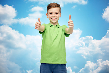 Image showing happy boy in green polo t-shirt showing thumbs up