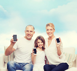 Image showing happy family with smartphones