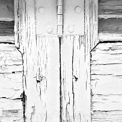 Image showing in the old wall a hinged window green wood and rusty metal