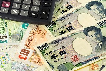 Image showing Forex - British and Japanese currency pair with calculator

